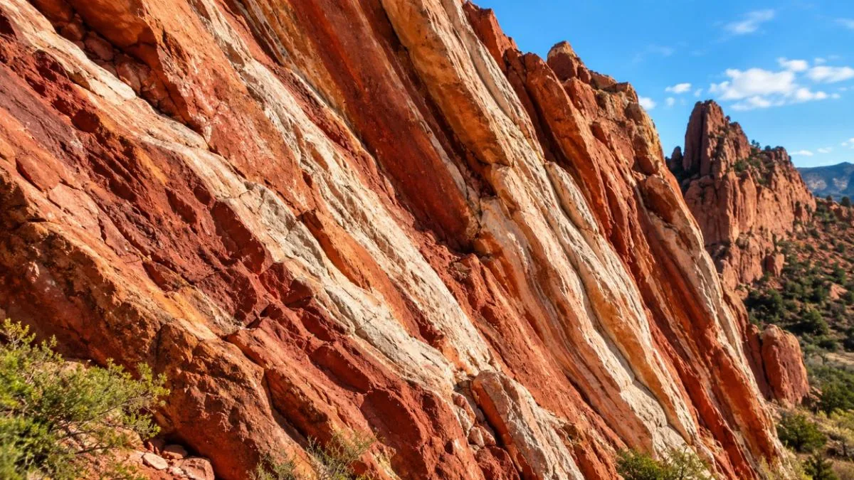 Tilted red and white sandstone layers, seen close up