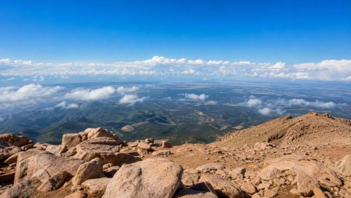 The view from the summit of Pikes Peak over lower ridges and plains