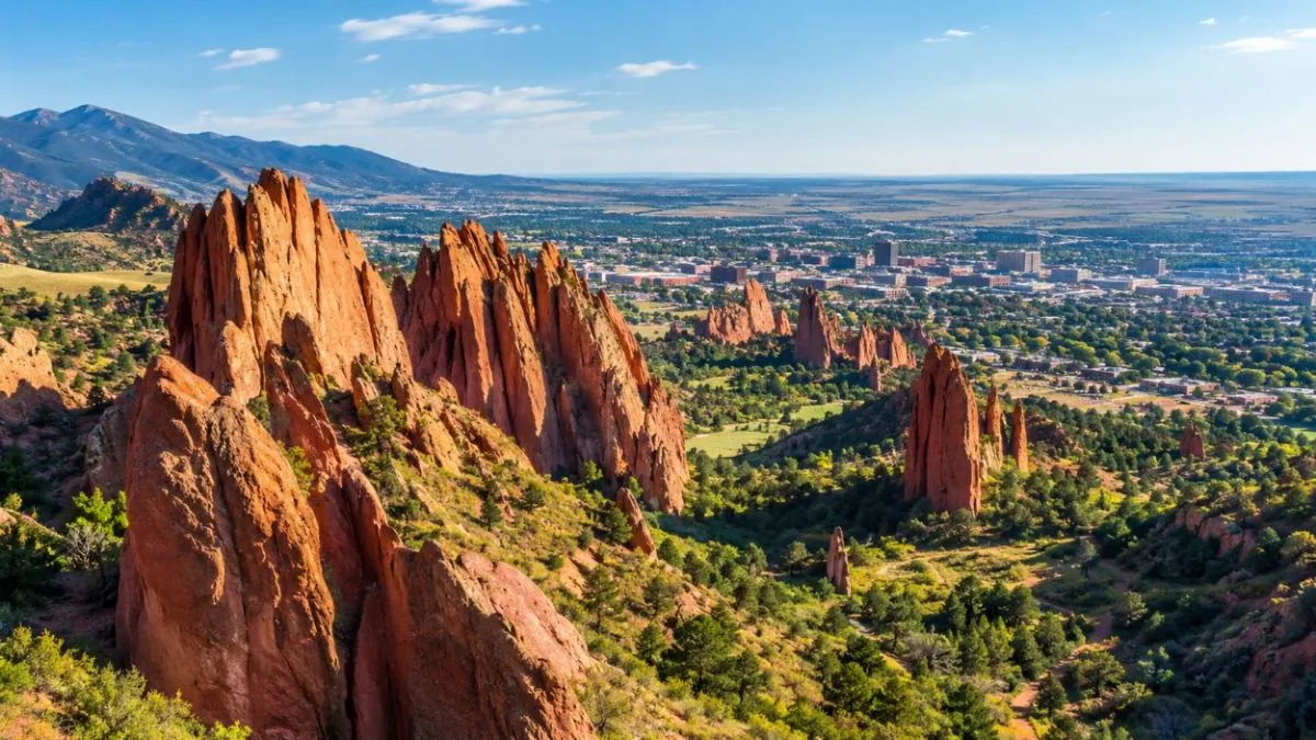 The red rocks of Garden of the Gods with the city and plains beyond