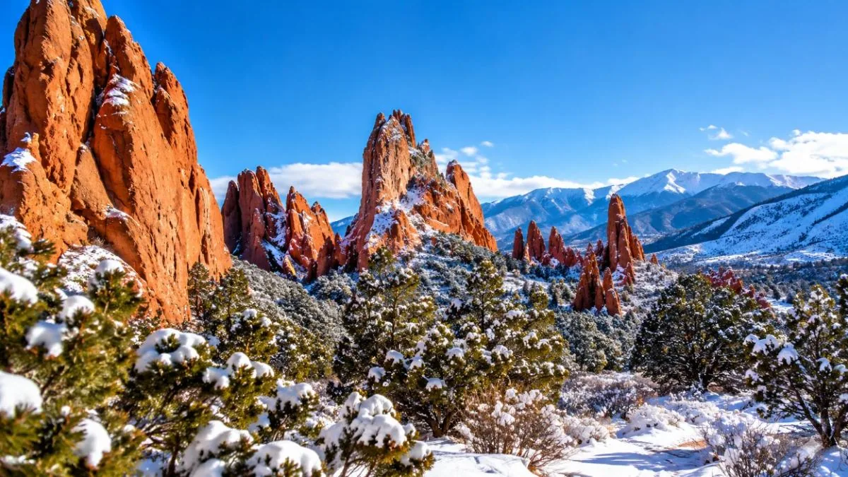 Fresh snow on the ground below the red rocks of Garden of the Gods